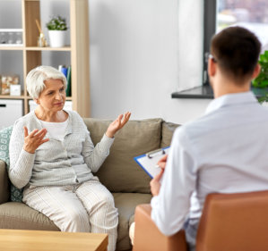 senior woman patient and psychologist at psychotherapy session